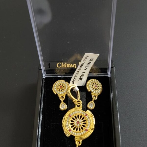 Ornate Gold-Plated Circular Pendant and Earring Set.